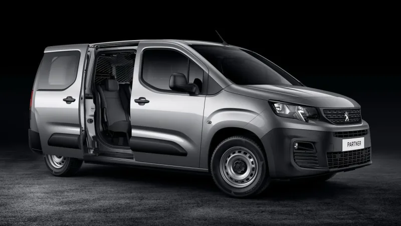 A silver Peugeot Partner van with its sliding side door open